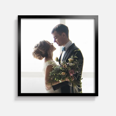 Snapfish Framed Photo Tile featuring a wedding photo of a couple with a black frame displayed on a wall